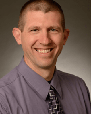 Headshot of Adam Powell.