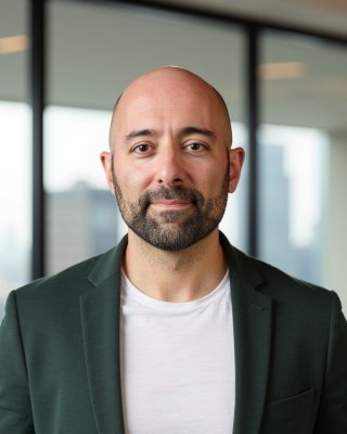 Headshot of Reza Ghomi.