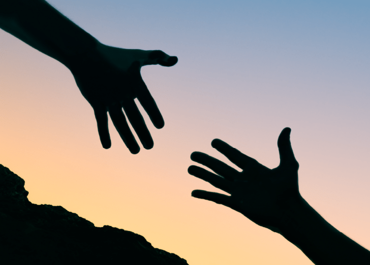 silhouette image of two hands.