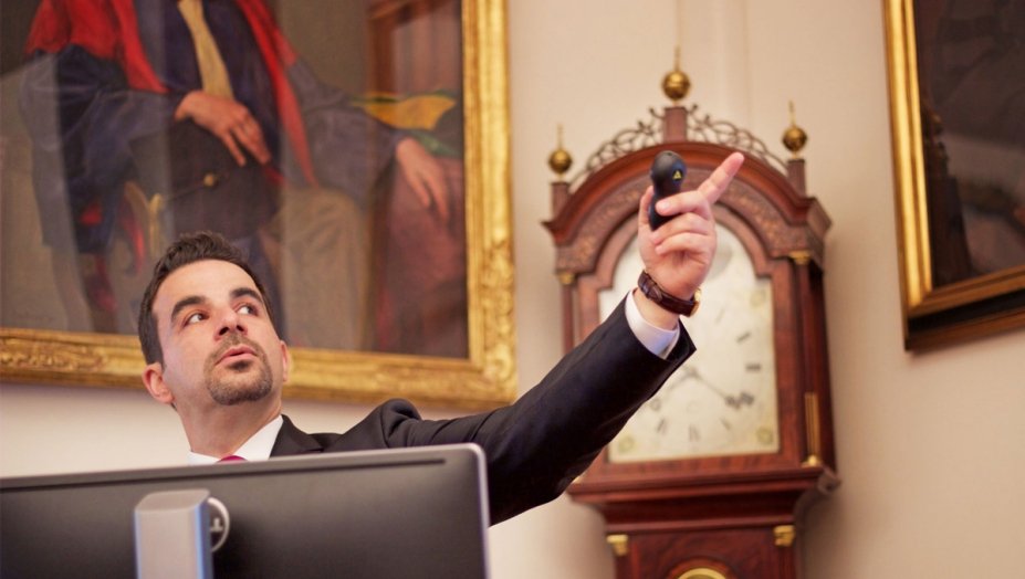 A man speaking and pointing.