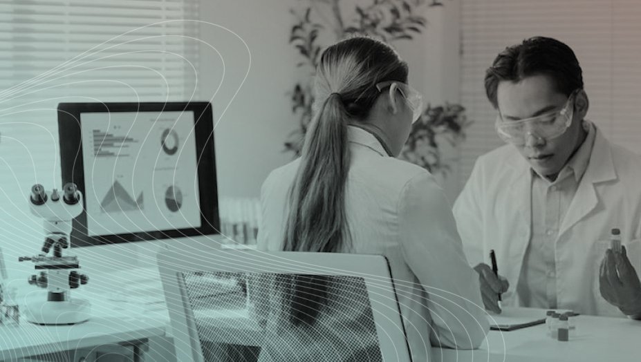 Two health care providers looking at data.