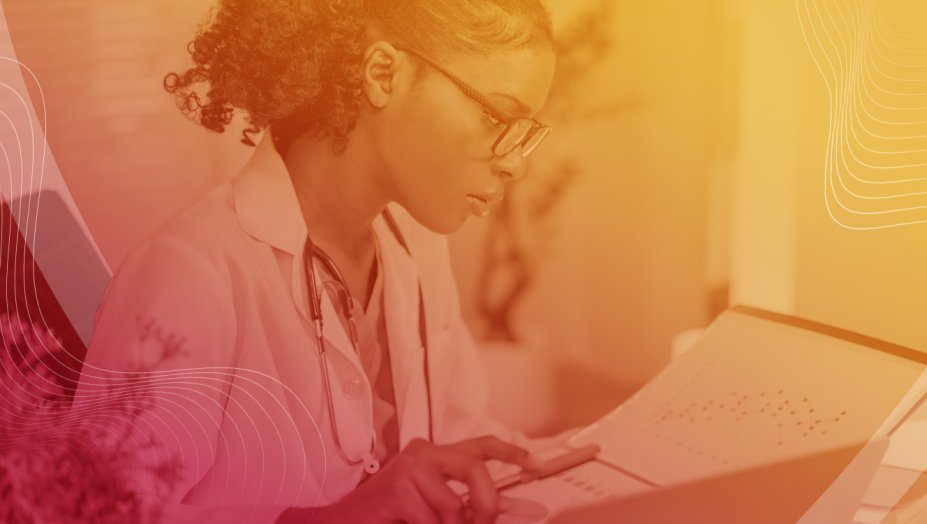 A health care provider looking at a screen with a red to yellow overlay over the image.